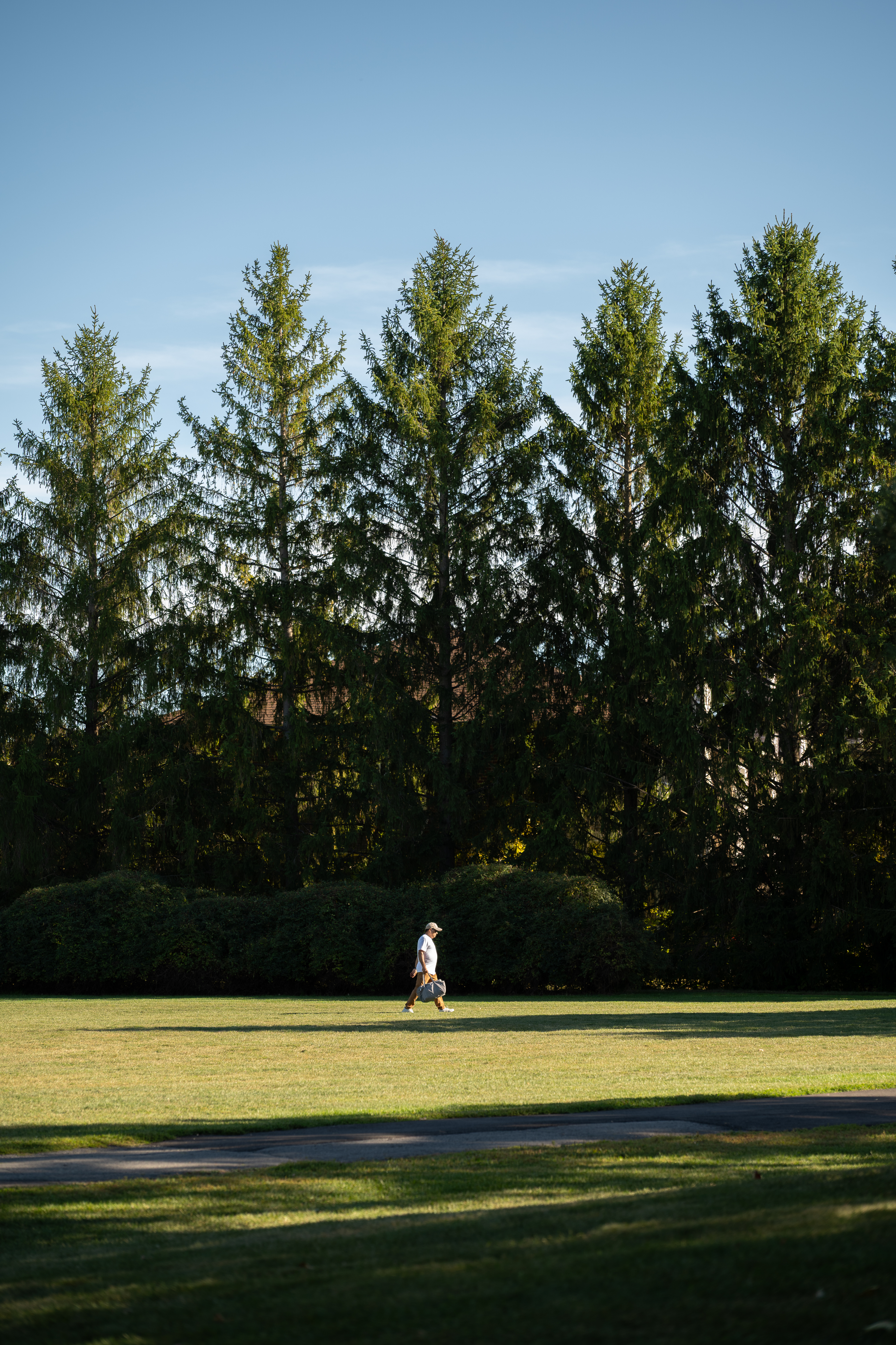 Man in front of trees